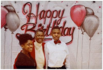 Mary Fisher with grandchildren at 70th birthday party