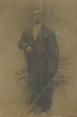 A man posing in a suit