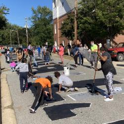View of North College Avenue during the painting of the Black Lives Matter street mural