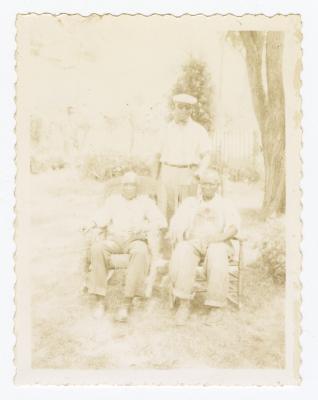 Three older men outside