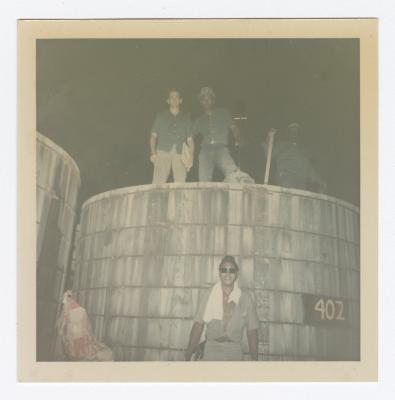 VITA Foods employees pose by tank
