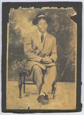 Young man in a large suit