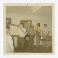 Group of men in an office at VITA Foods 1970 December