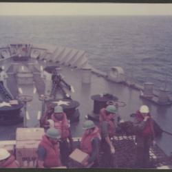 Crew aboard a naval vessel