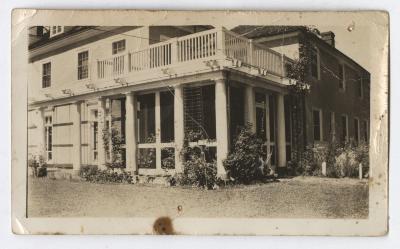 A large building with a screened-in porch