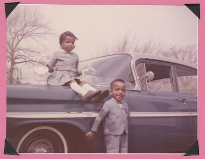 Two children with car