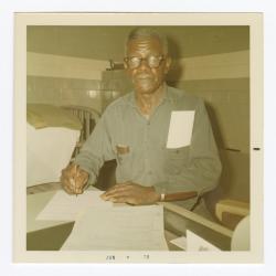 R. Henry Ford completing VITA Foods paperwork