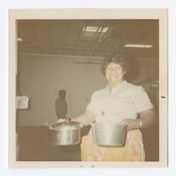 VITA Foods employee holding pots