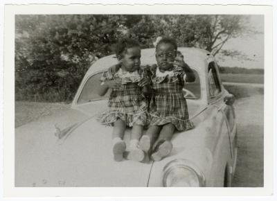 Ringgold sisters atop a car