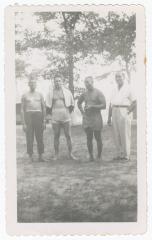 Four men vacationing at Sparrow's Beach
