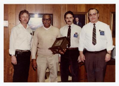 Sam Ringgold Sr. receiving a clock for 25 years at General Motors