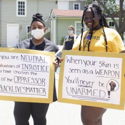 Two women with protest signs